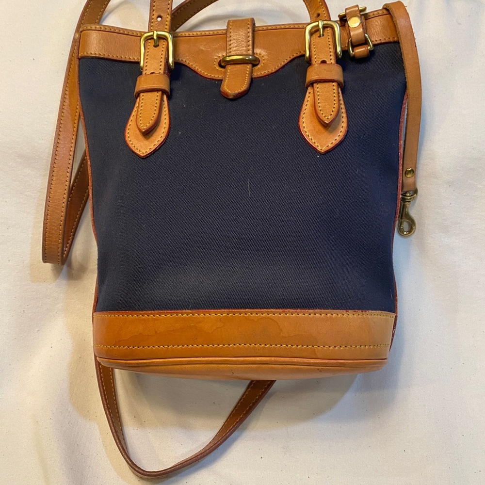 Dooney & Bourke medium canvas and leather tote bag.  Gently used.  Navy & tan
